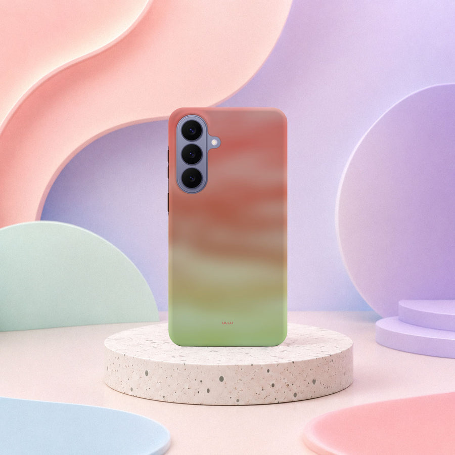 Samsung Galaxy S26 Plus-deksel Koralldis med en gradient fra korall til limegrønt i lyst interiør