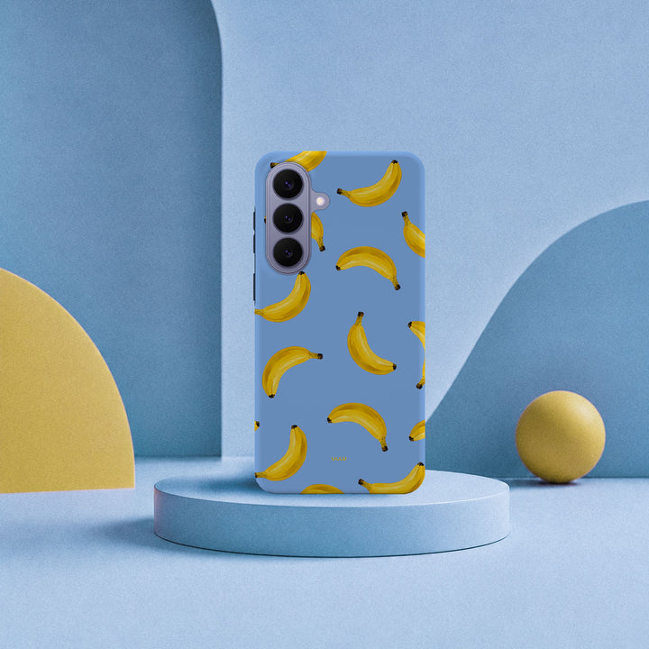 Samsung Galaxy S26 Plus-deksel Bananorama med gule bananer på lyseblå bakgrunn i lyst interiør