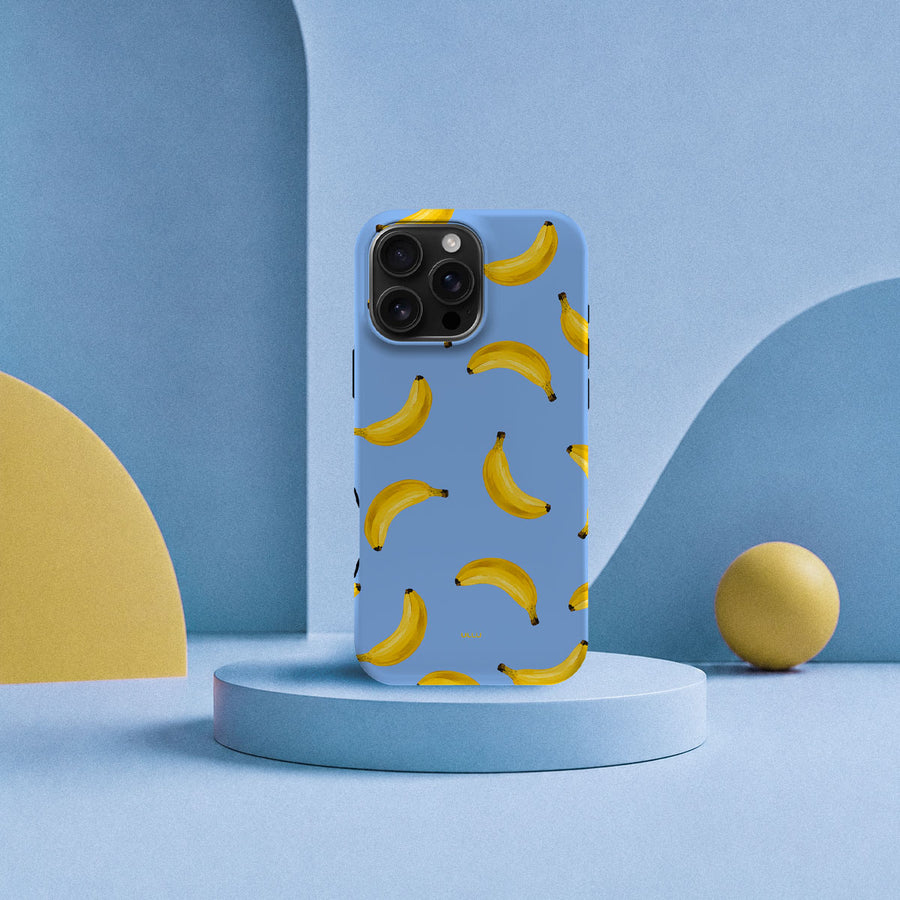 iPhone 16 Pro Max-deksel Bananorama med gule bananer på lyseblå bakgrunn i lyst interiør
