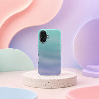 iPhone 16 deksel Himmeldis med blågrønn og lilla gradient i mykt pastellinteriør