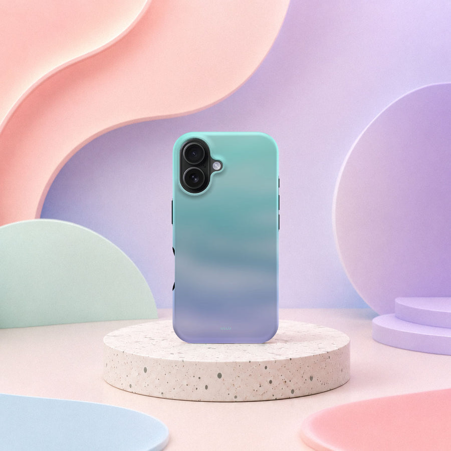 iPhone 16 deksel Himmeldis med blågrønn og lilla gradient i mykt pastellinteriør