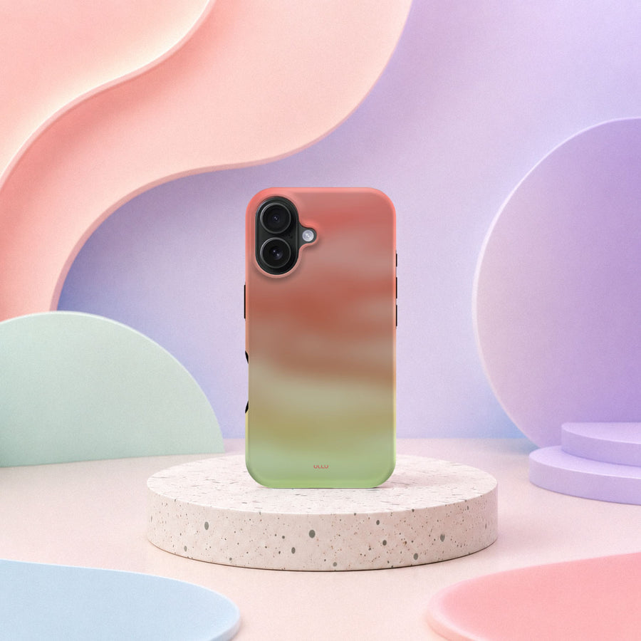 iPhone 16 deksel Koralldis med korallrosa, beige og grønn gradient i mykt pastellinteriør