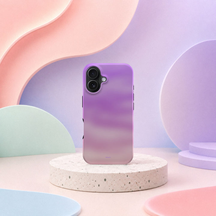iPhone 16 deksel Lilladis med lilla og rosa gradient i mykt pastellinteriør
