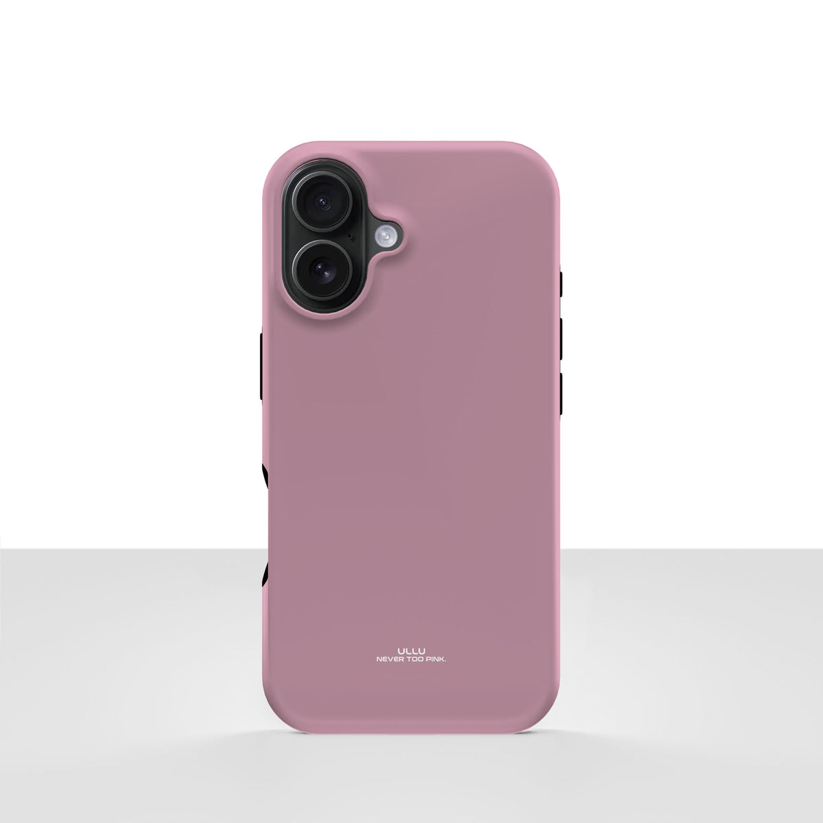 iPhone 16-deksel Never too PINK med en ren, dempet rosatone, vist bakfra