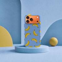 iPhone 17 Pro Max-deksel Bananorama med gule bananer på lyseblå bakgrunn i lyst interiør