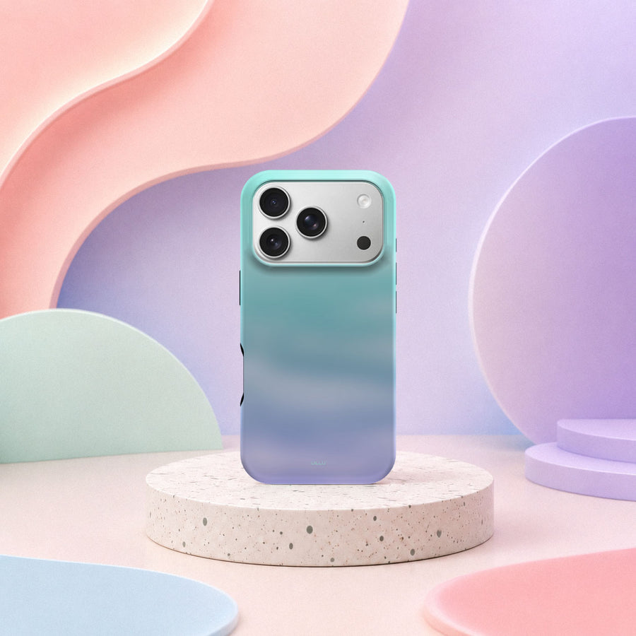 iPhone 17 Pro deksel Himmeldis med blågrønn og lilla gradient i mykt pastellinteriør